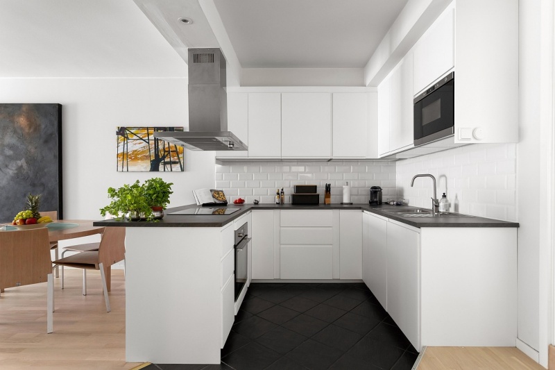 oak cabinets with black countertops