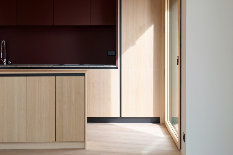 Custom built light wood kitchen cupboards