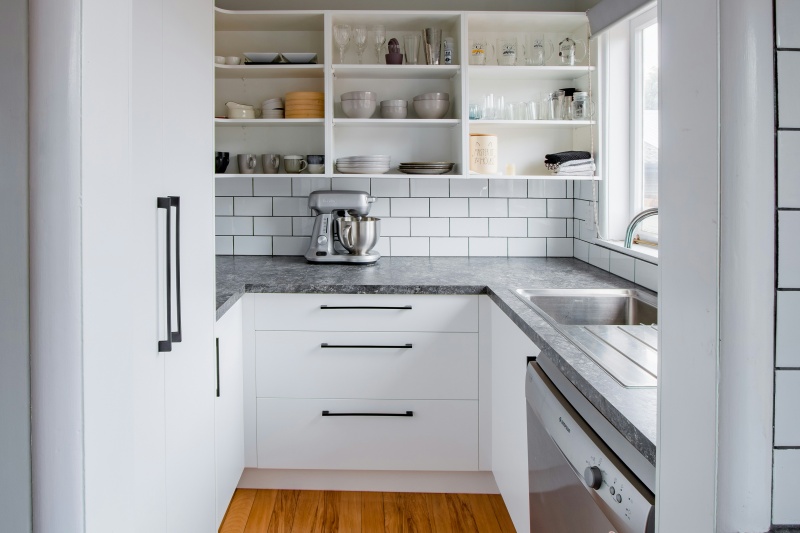 Space-saving white frameless plywood cabinets