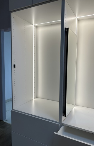 Wooden wardrobe with custom lighting features