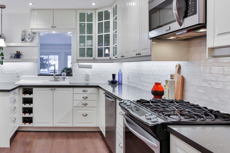 Custom white cabinetry with wine display Custom white cabinetry with wine display