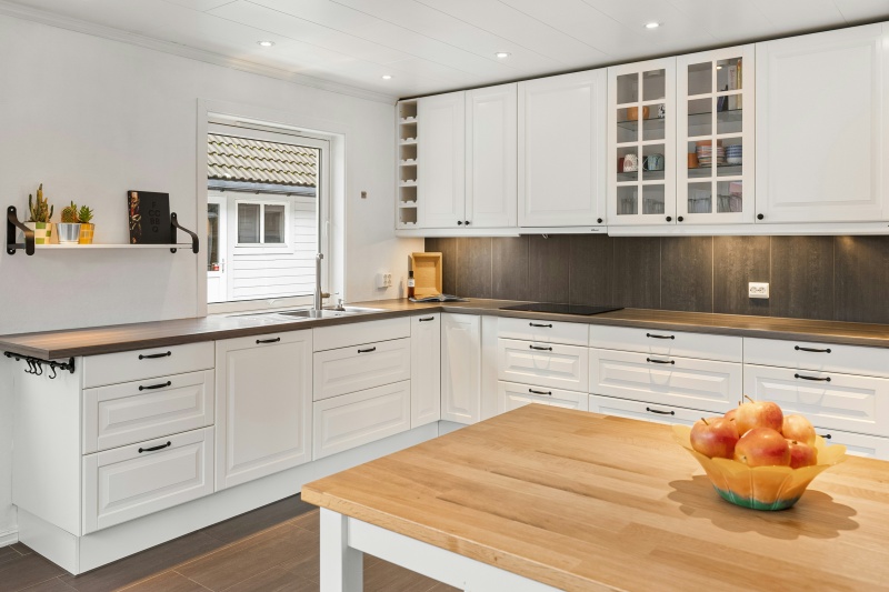 Custom white cabinetry with wine display Custom white cabinetry with wine display
