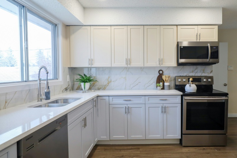 Utilizing statement light fixtures above cabinets Utilizing statement light fixtures above cabinets