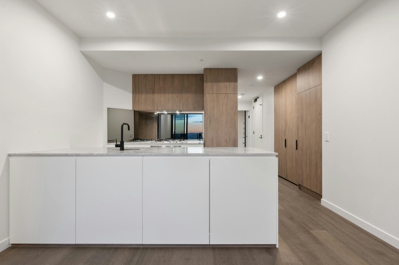 Hidden handles for flat panel cabinets Hidden handles for flat panel cabinets